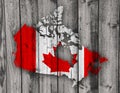 Map and flag of Canada on weathered wood Royalty Free Stock Photo