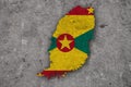 Map and flag of Grenada on weathered concrete Royalty Free Stock Photo