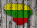 Map and flag of Lithuania on weathered wood Royalty Free Stock Photo