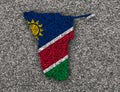 Map and flag of Namibia on poppy seeds