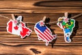 Map flag of North, South America, Canada hanging on a rope on wooden clothespins. Rustic Christmas decoration. Royalty Free Stock Photo