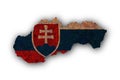 Map and flag of Slovakia on rusty metal