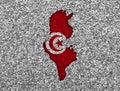 Map and flag of Tunisia on poppy seeds Royalty Free Stock Photo