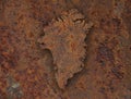 Map of Greenland on rusty metal