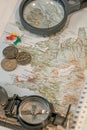 Map of Iceland, push pins, compass, Icelandic money and lens magnifier as ultimate items for successful traveler, abstract, Royalty Free Stock Photo