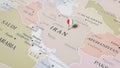 A Map of Iran, with a Pin Featuring the Iranian Flag Royalty Free Stock Photo