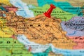 Map of Iran with a red pushpin stuck