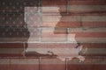 Map of louisiana state on a painted flag of united states of america on a brick wall Royalty Free Stock Photo