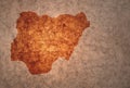 Map of nigeria on a old vintage crack paper background