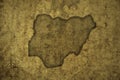 map of nigeria on a old vintage crack paper background