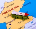 Map of North Korea with a military machine