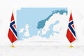 Map of Norway and flags of Norway on flag stand Royalty Free Stock Photo