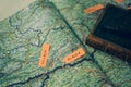 A map of road routes in Europe, open on a page with a map of Austria, and a notebook with a pen Royalty Free Stock Photo