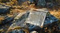 A map is spread out on a campsite its corners weighed down by rocks. The map shows a path through the wilderness leading Royalty Free Stock Photo