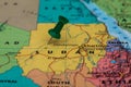 Map of Sudan with a green pushpin stuck