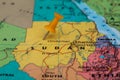 Map of Sudan with a orange pushpin stuck