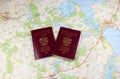 Map and two passports ready to be used. Color photo.