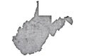 Map of West Virginia on weathered concrete
