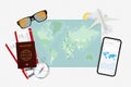 Map of the world in green with cell phone, passport, airline tickets, sunglasses, etc Royalty Free Stock Photo