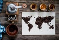 Map of the world, lined with coffee beans on old paper. Eurasia, America, Australia, Africa. vintage. Black coffee