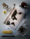 Map of the world, lined with tea leaves. Eurasia, America, Australia, Africa. vintage. sugar, note, cracker, spoon. top