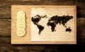 Map of the world, lined with tea leaves on old paper.