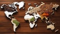 Map of world made from different kinds of spices on wooden background Royalty Free Stock Photo