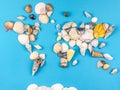 Map of the world made of shells on blue background Royalty Free Stock Photo