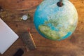 A map of the world with a notebook, a compass, a smart phone. Royalty Free Stock Photo
