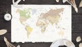 Map of the world on old paper surrounded by compass, anchor, lifebelt and shells Royalty Free Stock Photo