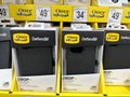 Otterbox Defender Series black iPhone 14 model phone cases for sale at a Sams Club