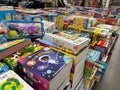 Various childrens books and activity sets for sale at a Costco Warehouse store