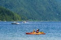 MAPLE RIDGE, CANADA - JUNE 28, 2020: Alouette Lake view from South Beach green mountains and white clouds Royalty Free Stock Photo