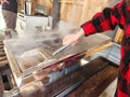 Maple syrup boilling in evaporator tub with skimmer in maplehouse. Maple farming. Tools and equipment. Royalty Free Stock Photo