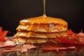 maple syrup drizzling over a stack of pancakes