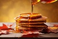 maple syrup drizzling over a stack of pancakes