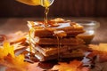 maple syrup drizzling over waffles