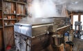 A maple sap evaporator and boiler in a New Hampshire sugar shack. Royalty Free Stock Photo