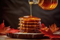 maple syrup pouring onto a stack of pancakes Royalty Free Stock Photo