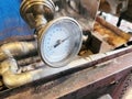 Maple syrup evaporator thermometer in maplehouse. Maple farming. Tools and equipment. Royalty Free Stock Photo