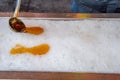 Maple taffy on snow during sugar shack period.