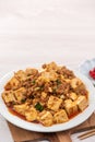 Mapo tofu, stir-fried tofu with hot spicy sauce in white plate Royalty Free Stock Photo