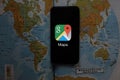 Maps and iphone 11 pro with the Google Maps logo Royalty Free Stock Photo