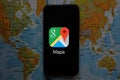 Maps and iphone 11 pro with the Google Maps logo Royalty Free Stock Photo
