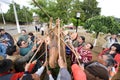 Mapuches with palines in front of the monument to Lautaro