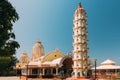 Mapusa, Goa, India. Lamp Tower And Temple Of The Shree Ganesh Mandir, Ganeshpuri. Famous Landmark And Popular