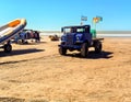 Old blue rusty 1940s Ford Blitz truck still in use to tow fishing boats on the beach. Copyspace