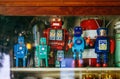 Group of colourful vintage retro tin toy robot team