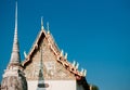 Wat Uposatharam Temple or Wat Bot at noon under clear blue sky,