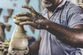 Artist's hands building ceramic pieces